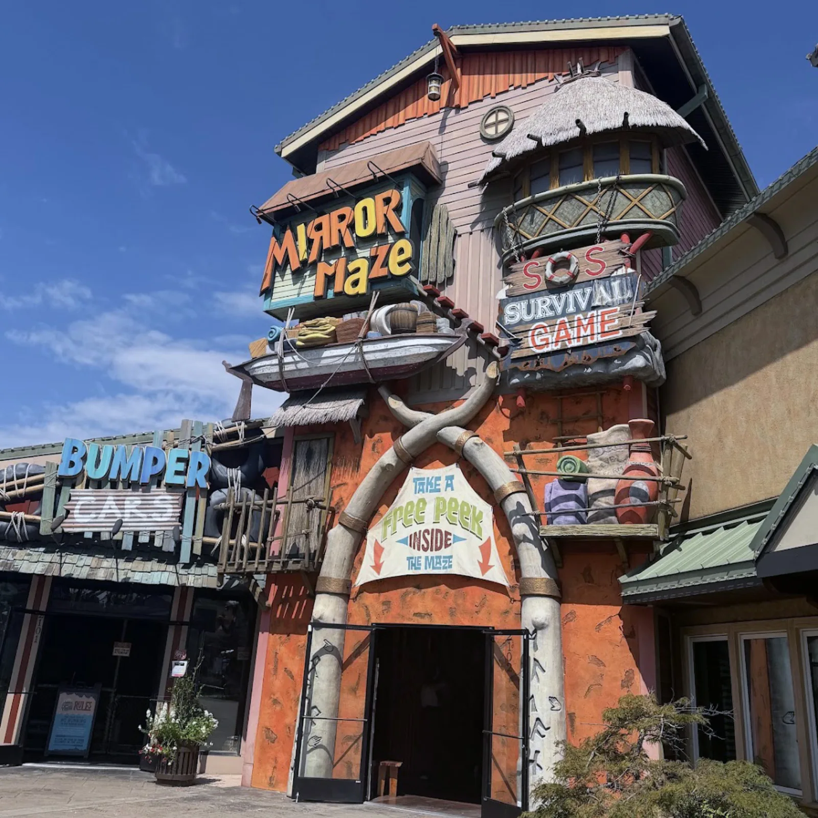 Gatlin's Mirror Maze facade in Pigeon Forge with SOS Survival Game signage above the entrance