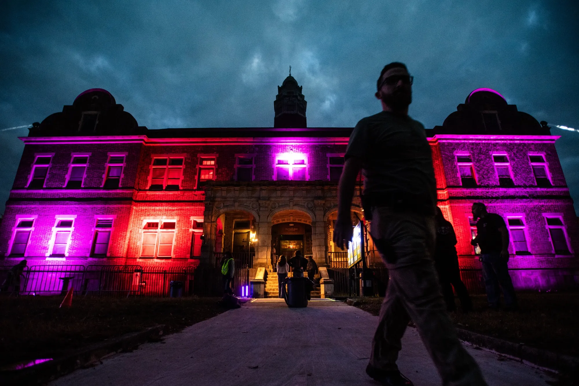 Pennhurst Asylum building with blue DMX wall wash and moving head searchlight